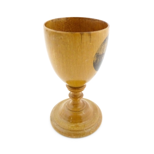 1146 - A 19thC Mauchline ware egg cup with a vignette depicting Stirling Castle. Approx. 3 1/4