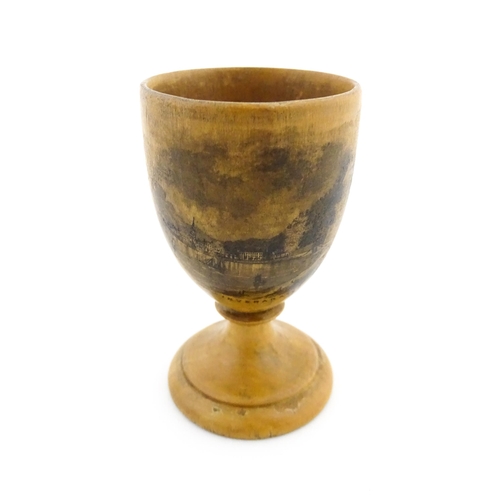 1147 - A 19thC Mauchline ware egg cup with a vignette depicting Inveraray. Approx. 2 3/4