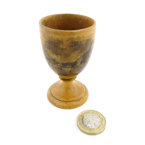 1147 - A 19thC Mauchline ware egg cup with a vignette depicting Inveraray. Approx. 2 3/4