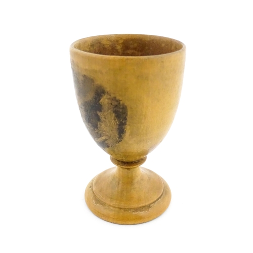 1147 - A 19thC Mauchline ware egg cup with a vignette depicting Inveraray. Approx. 2 3/4