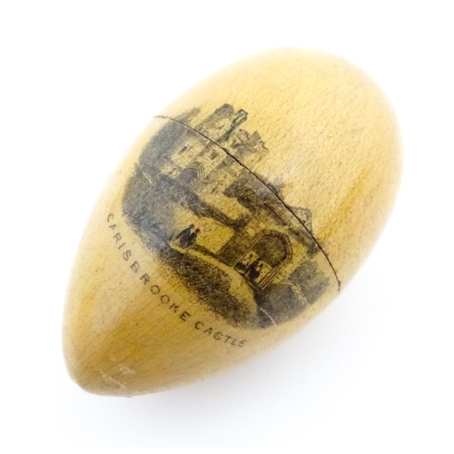 1149 - A 19thC Mauchline ware sewing thimble case of egg form with vignette depicting Carisbrooke Castle, c... 