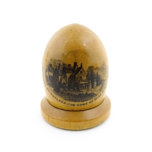 1151 - A 19thC Mauchline ware sewing thimble case of dome form with a vignette depicting Lea Hurst, Near Ma... 