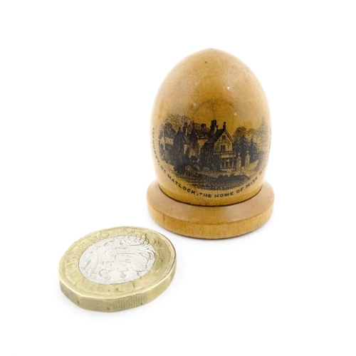 1151 - A 19thC Mauchline ware sewing thimble case of dome form with a vignette depicting Lea Hurst, Near Ma... 