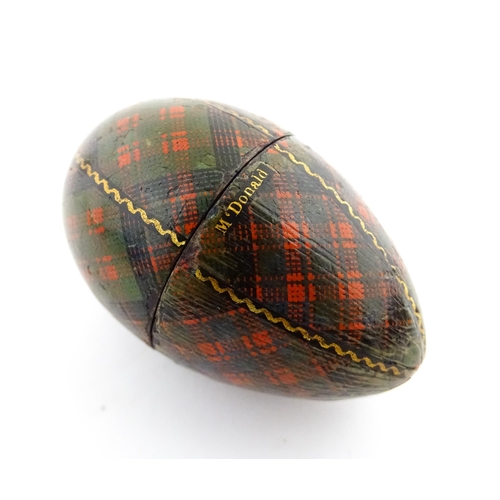 1154 - A 19thC Tartan ware sewing thimble case of egg form, titled McDonald. Approx. 2