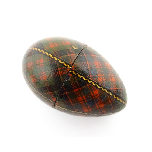 1154 - A 19thC Tartan ware sewing thimble case of egg form, titled McDonald. Approx. 2