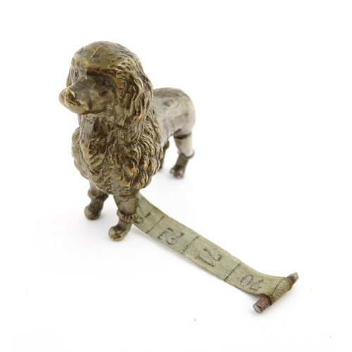1156 - A Victorian cast brass novelty sewing tape measure modelled as a Poodle dog. Approx. 2