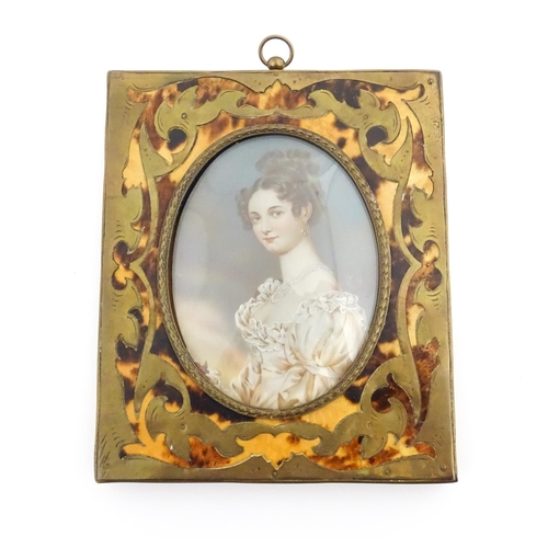 1162 - An early 20thC watercolour portrait miniature depicting a seated young lady wearing a three strand p... 