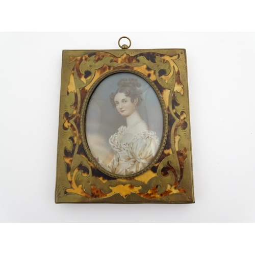 1162 - An early 20thC watercolour portrait miniature depicting a seated young lady wearing a three strand p... 