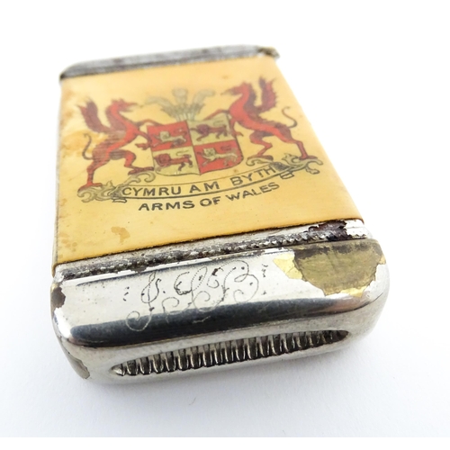 1170 - A 20thC Welsh vesta case decorated with a vignette depicting Conway / Conwy Castle to one side, the ... 