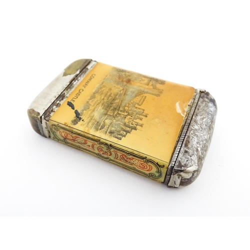 1170 - A 20thC Welsh vesta case decorated with a vignette depicting Conway / Conwy Castle to one side, the ... 