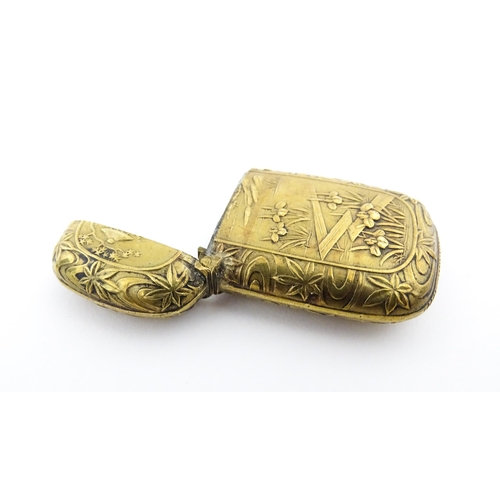 1173 - A 20thC brass vesta case with Oriental decoration. Approx. 1 3/4