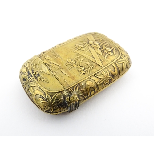 1173 - A 20thC brass vesta case with Oriental decoration. Approx. 1 3/4