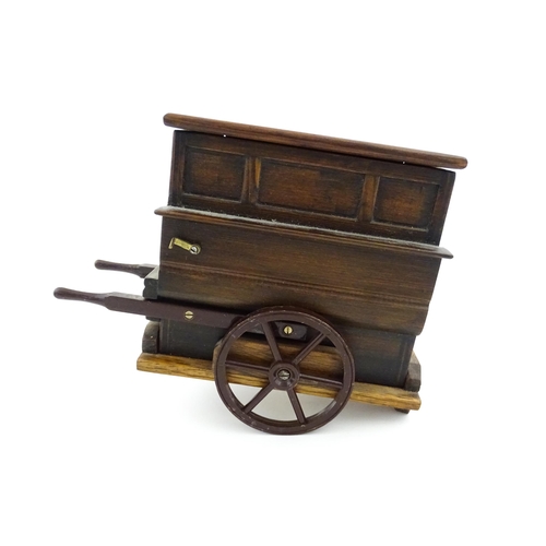 1174 - A 20thC novelty music box modelled as a street / barrow organ by Tallent of Bond Street. Numbered un... 