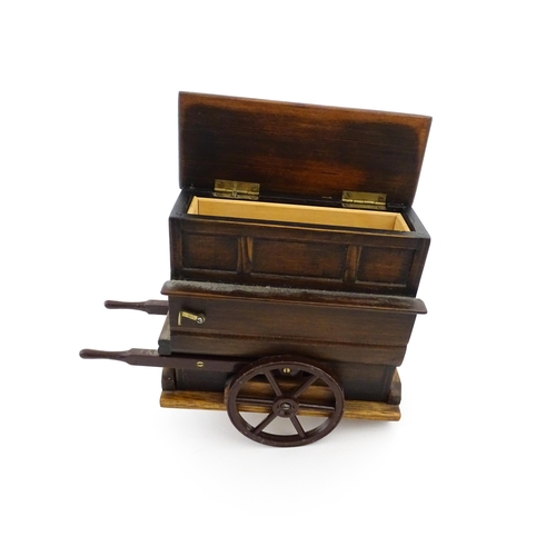 1174 - A 20thC novelty music box modelled as a street / barrow organ by Tallent of Bond Street. Numbered un... 