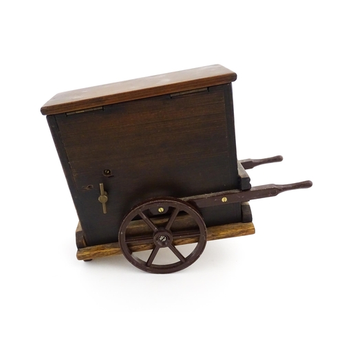 1174 - A 20thC novelty music box modelled as a street / barrow organ by Tallent of Bond Street. Numbered un... 