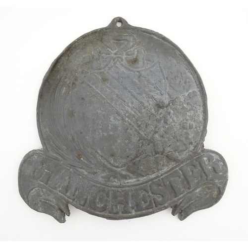 1177 - A reproduction cast lead fire mark for Manchester. Approx. 9 1/2