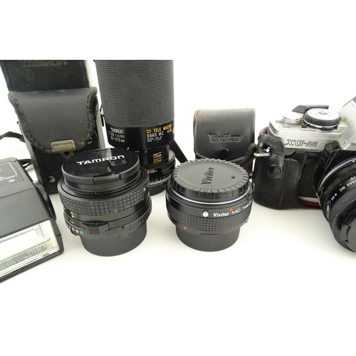 1179 - A Minolta XG-M camera and Minolta Drive 1 with Tamron Adaptall 2 1:25 28mm lens together with a Vivi... 