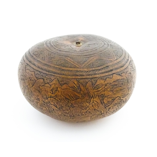 1198 - A late 19th / early 20thC gourd with naive engraved decoration depicting farmers working in the fiel... 