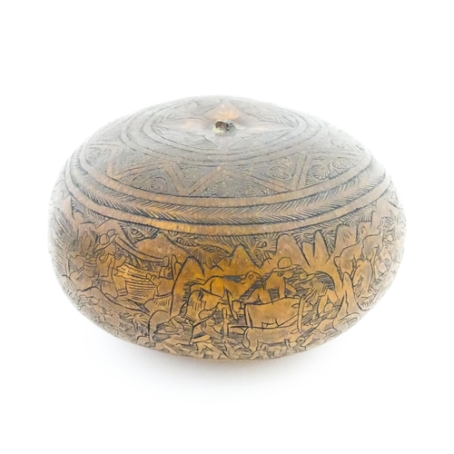 1198 - A late 19th / early 20thC gourd with naive engraved decoration depicting farmers working in the fiel... 