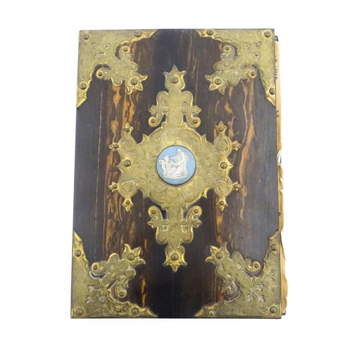 1208 - A Victorian blotter with coromandel front cover with decorative brass mounts and set with central Ja... 