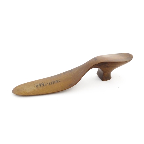 1210 - A 19thC French novelty treen souvenir shoehorn modelled as a ladies heeled shoe engraved Menton. App... 