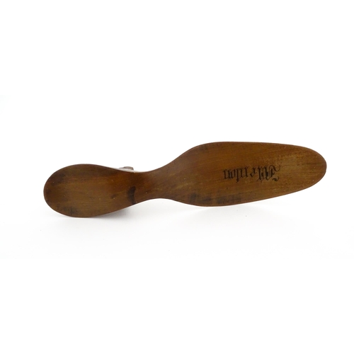 1210 - A 19thC French novelty treen souvenir shoehorn modelled as a ladies heeled shoe engraved Menton. App... 