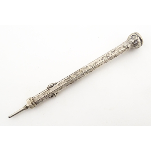 1211 - A Victorian silver combination pen and pencil with engraved decoration and seal top, hallmarked Birm... 