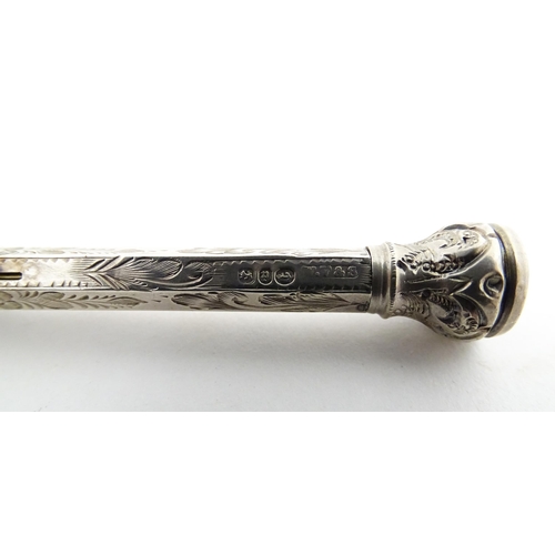 1211 - A Victorian silver combination pen and pencil with engraved decoration and seal top, hallmarked Birm... 