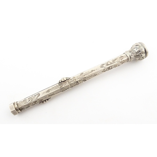 1211 - A Victorian silver combination pen and pencil with engraved decoration and seal top, hallmarked Birm... 