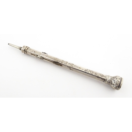 1211 - A Victorian silver combination pen and pencil with engraved decoration and seal top, hallmarked Birm... 