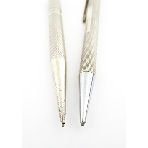 1213 - Two silver propelling pencils with engine turned decoration, one an Art Deco Mordan Everpoint hallma... 