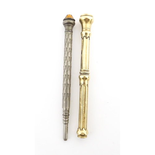 1214 - A gilt metal pencil slide with seal end. Together with a silver plate propelling pencil with engrave... 