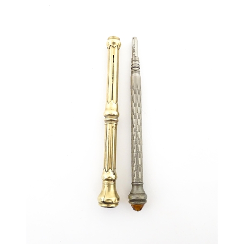 1214 - A gilt metal pencil slide with seal end. Together with a silver plate propelling pencil with engrave... 