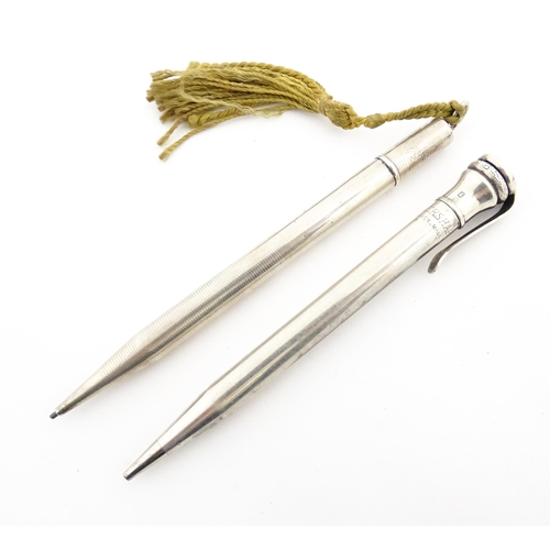 1217 - Two silver propelling pencils, comprising an Eversharp example hallmarked London 1936, the other hal... 