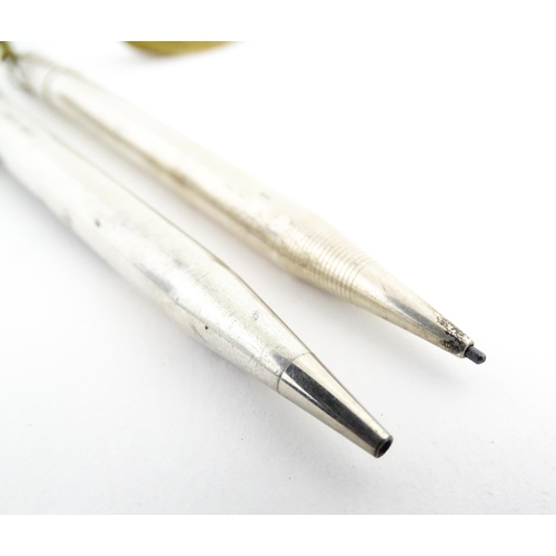 1217 - Two silver propelling pencils, comprising an Eversharp example hallmarked London 1936, the other hal... 