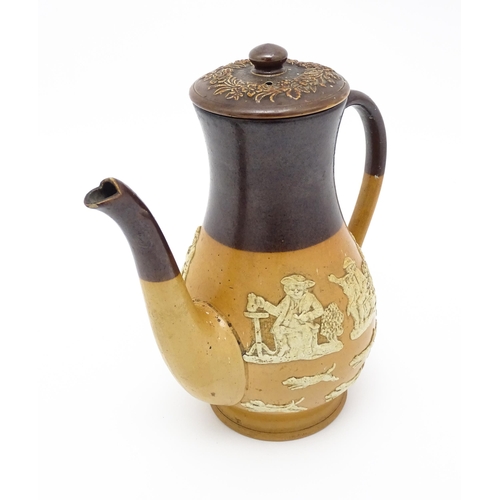 122 - A Royal Doulton two tone coffee pot with applied relief rural decoration. Marked under. Approx. 9 3/... 