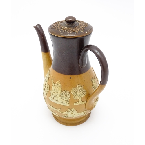 122 - A Royal Doulton two tone coffee pot with applied relief rural decoration. Marked under. Approx. 9 3/... 