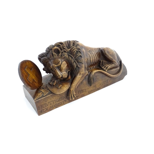 1226 - A late 19thC carved walnut model of the Lion of Lucerne after Bertel Thorvaldsen, inscribed Helvetio... 