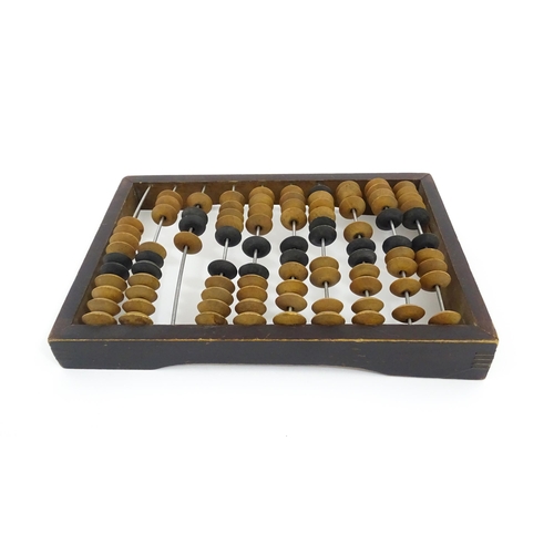 1231 - A Russian table top abacus. Bears remains of label with Cyrillic script. Approx. 9 1/2