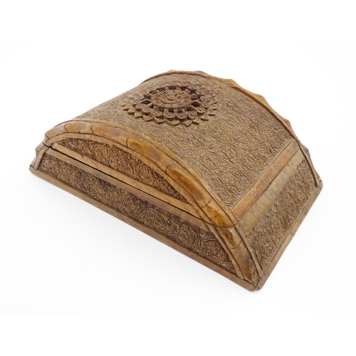 1237 - A 20thC Anglo-Indian carved wooden cigar / cigarette box of dome form with engraved floral decoratio... 