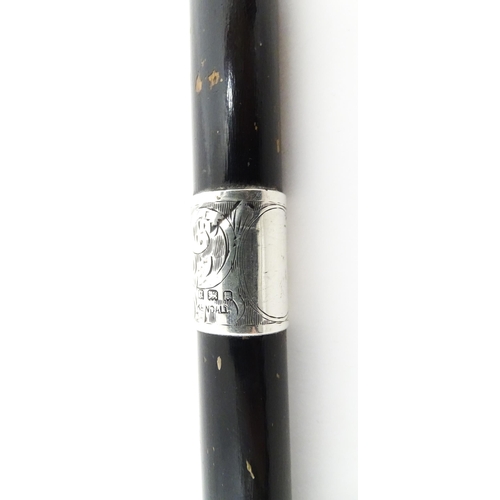 1247 - Three Victorian and later ebonised walking sticks / canes, one with an embossed silver top depicting... 