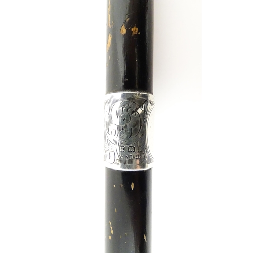 1247 - Three Victorian and later ebonised walking sticks / canes, one with an embossed silver top depicting... 