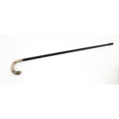 1253 - An ebonised walking stick / cane with Swedish .830 silver handle. Approx. 36 1/2