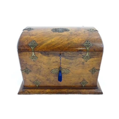 1259 - A late Victorian burr walnut table casket, with pierced brass strapwork and a hinged lid. Bearing pl... 