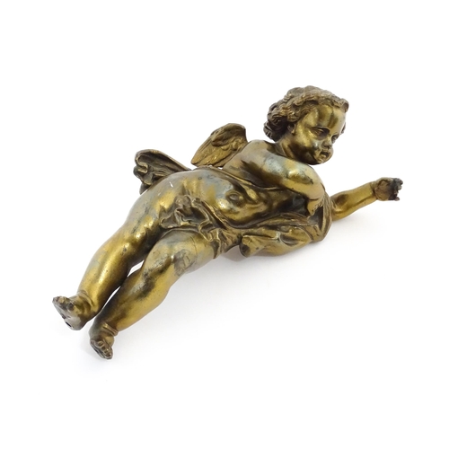 1263 - A 20thC cast model of a winged putto / cherub. Approx. 11