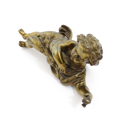 1263 - A 20thC cast model of a winged putto / cherub. Approx. 11