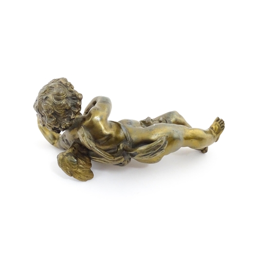 1263 - A 20thC cast model of a winged putto / cherub. Approx. 11