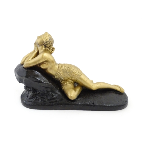 1266 - A 20thC composite model of a reclining nude, Femme sur Rocher after James Pradier. Approx. 10 1/4