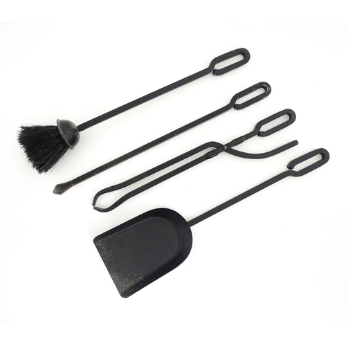 1275 - A 20thC cast fireside companion set, tools comprising shovel, tongs, brush and poker. Stand approx. ... 