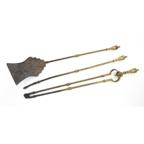 1277 - A late 19th / early 20thC brass fireside companion set, tools comprising shovel, tongs and poker. Ea... 